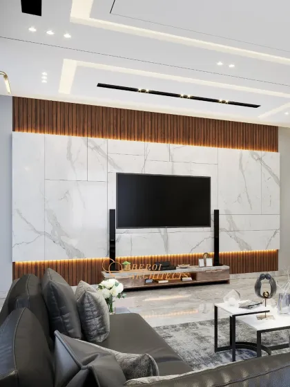 The media wall is a stunning focal point, combining a large marble panel with wood fluting and integrated backlighting. It’s a perfect blend of texture, luxury, and technology.