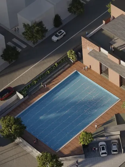 For the KMYF Rehabilitation Center, the site plan was a critical challenge. This bird's-eye view shows how we organized the building, parking, and a large public swimming pool on an irregular plot to create a functional and accessible community asset.