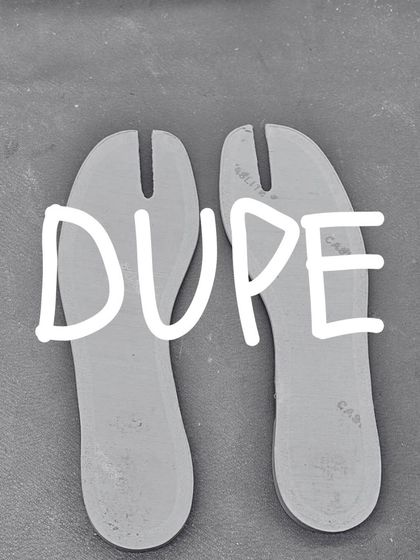 The split-toe insoles for the 'DUPE' Tabi flat, laid out before being placed in the shoe. Every component is carefully considered and crafted.