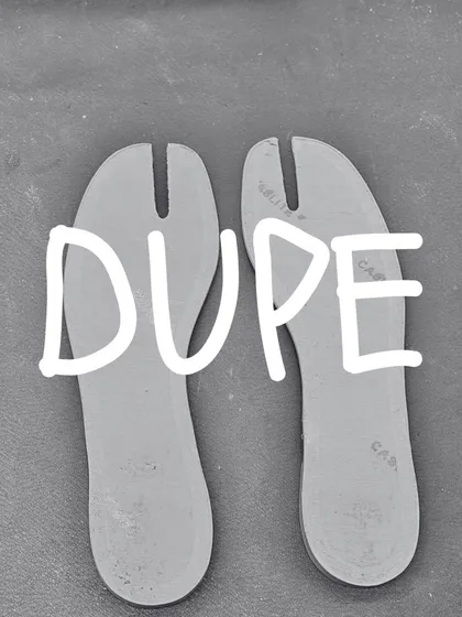The split-toe insoles for the 'DUPE' Tabi flat, laid out before being placed in the shoe. Every component is carefully considered and crafted.