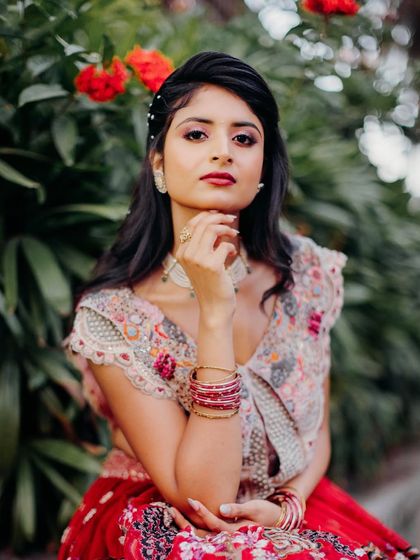 A more dramatic pose, showing off the makeup. The bold lip and defined eyes create a confident and striking look.