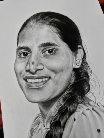 A portrait of a woman with a simple, warm smile and a traditional braid. My goal is to capture the essence of the person.