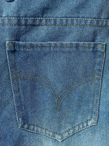 The signature arcuate stitching on the back pocket of a custom-made pair of jeans, a timeless detail that I can replicate for an authentic look.