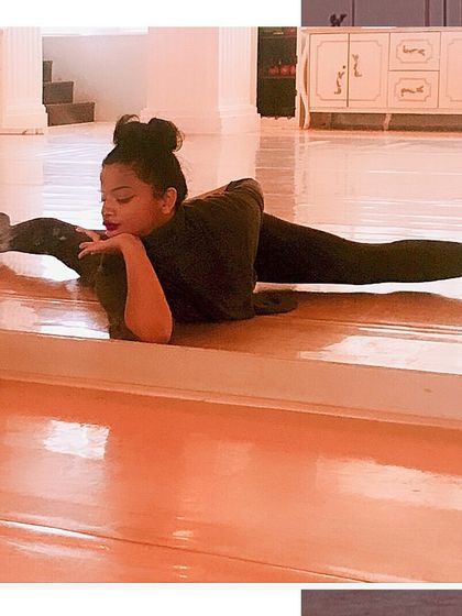 Flexibility is a cornerstone of dance. A young student demonstrates a perfect split, a result of consistent practice and dedication.