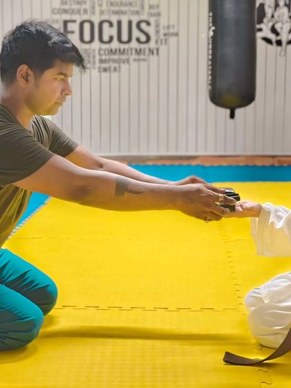 The formal presentation of a new belt. This ceremony is a mark of respect for the student's dedication and progress.