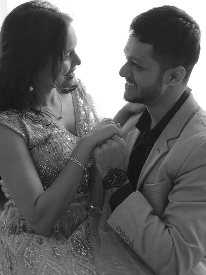 A happy, interactive moment between the couple, captured in beautiful monochrome.