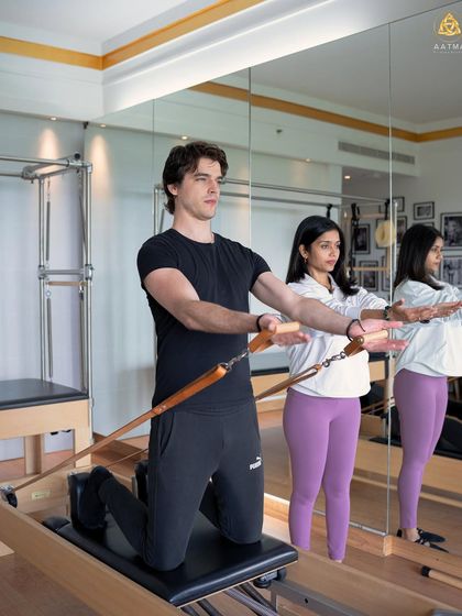 Teaching is a partnership. In this private session, I'm ensuring the client maintains proper form and engagement as he works with the resistance of the Reformer springs.