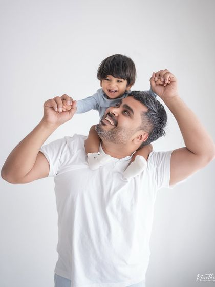 A father and son sharing a laugh during a shoulder-ride.