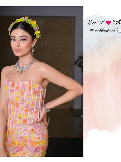 A full-length view of this unique Mehendi outfit and jewellery pairing. The modern silhouette of the dress is beautifully complemented by the classic sparkle of the diamond necklace.