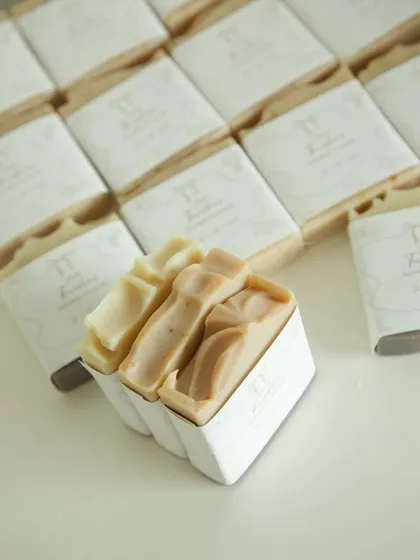 A peek inside the gift box, showing the two handmade soaps nestled together.
