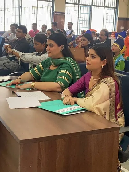 My judging process is one of deep observation and respect for each performer's journey. Here I am, fully engrossed in a performance at the School of Specialized Excellence, carefully considering the technical skill, creativity, and emotional depth of the presentation.