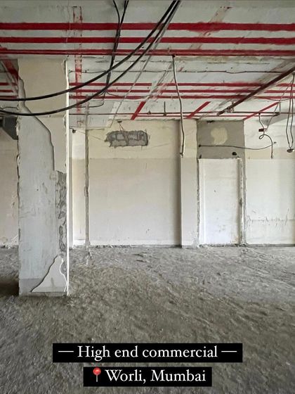 The raw, stripped-down site of a high-end commercial project in Worli, Mumbai. This is the blank canvas from which we begin to build, showing the potential of a space before our design intervention.