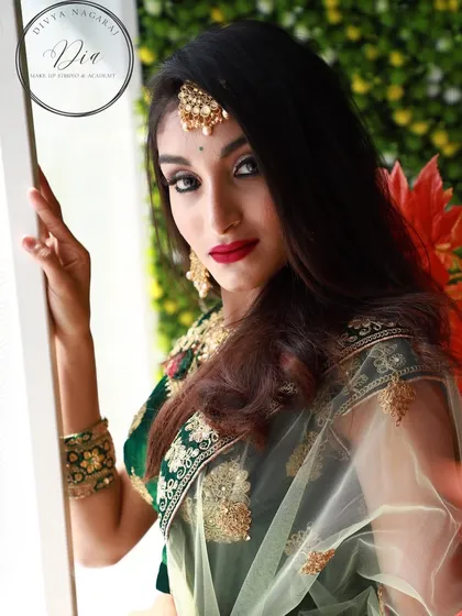 Elegance meets flawlessness in this dramatic look. A sharp, silver cut-crease eyeshadow is paired with a bold red lip and winged liner for a high-impact, glamorous result.