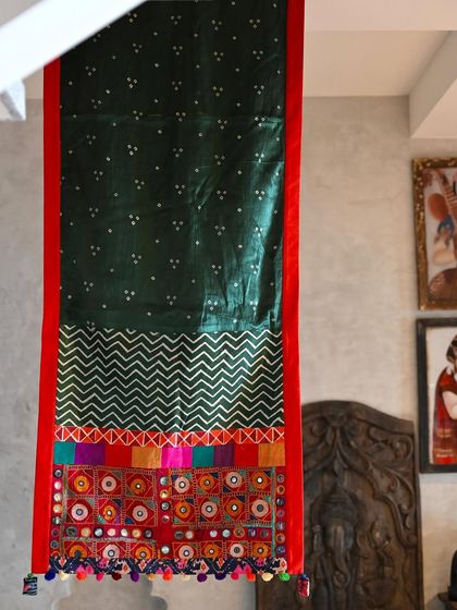 The full length of the throw, showcasing the combination of Bandhni tie-dye, geometric weaves, and the intricate vintage Kutch embroidery panel.