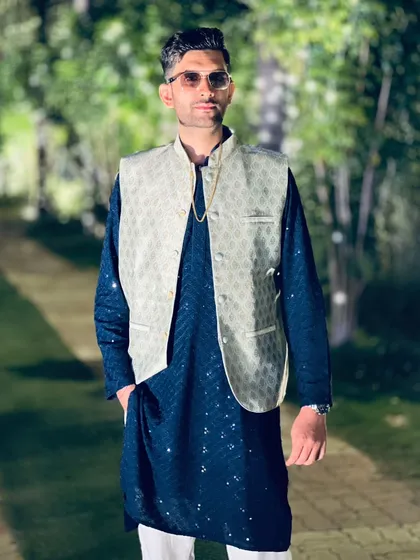 A confident pose in a classic ethnic ensemble. I believe in carrying myself with style and sophistication at every event.