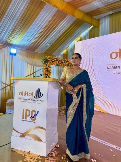 Standing at the podium for the Naman Industrial Park launch. The decor and my presence are aligned to reflect the significance of the occasion.