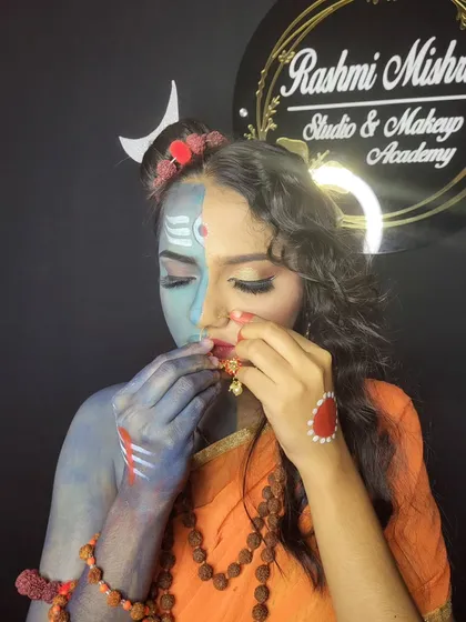 A close-up showing the intricate details, like the bindi, nose ring, and the blending of colors on the face.