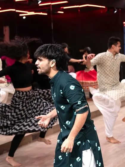 An action shot from the Spins and Barrels intensive. You can see the focus and energy as we practice the movements together. The synchronized motion and flowing ghagras create a beautiful visual.