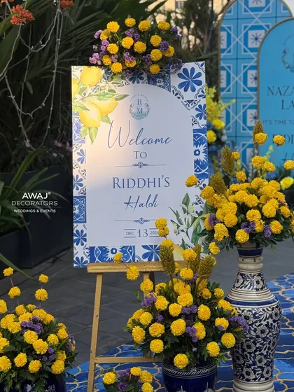 Another angle of the beautiful welcome easel, showing the detail in the custom artwork and the abundance of fresh marigolds.