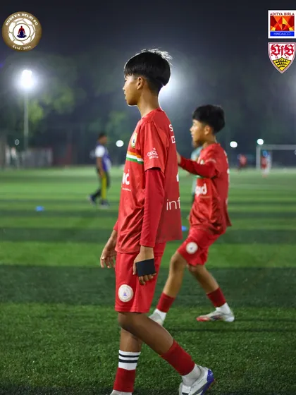 Two young players focused during a night training session. The grind never stops at Sudeva.