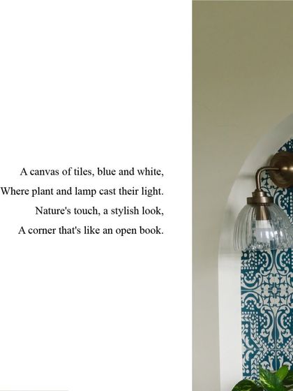 A canvas of tiles, blue and white, where plant and lamp cast their light. This corner is a stylish nook that feels like an open book.