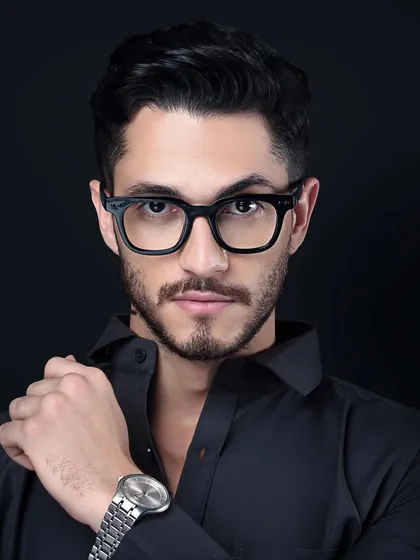 A powerful headshot of a male model, subtly associating a sense of style and confidence with the brand he represents, even without the product in the frame. This is great for brand-building campaigns.