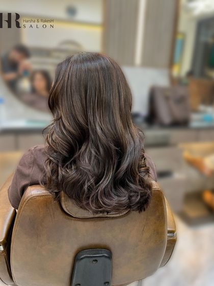 A side view of the global color and style, demonstrating the beautiful, consistent shade from roots to ends.