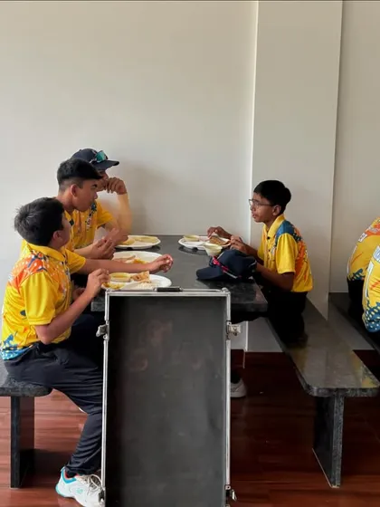Fueling up for the next game. Players enjoying a meal together. Our packages include unlimited and wholesome food to ensure everyone is well-fed and energetic.