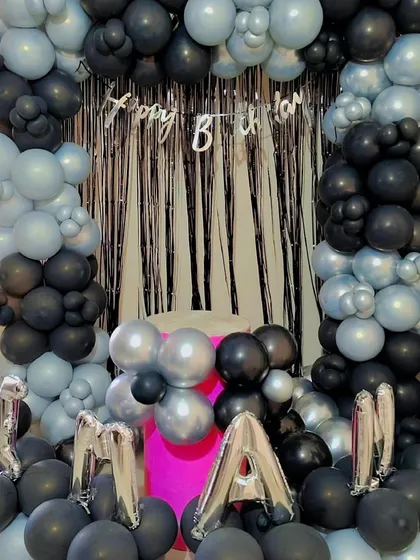 A closer look at the "MANAN" birthday setup with its modern color combination.