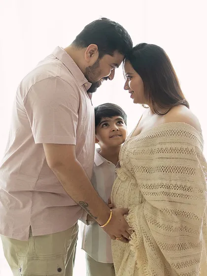 There is a sacred stillness when a family pauses to listen. Here, a big brother-to-be looks up with wonder as his parents share a quiet moment, their heads bowed together in love and anticipation. These natural light family maternity sessions are about capturing the connections that are already there.