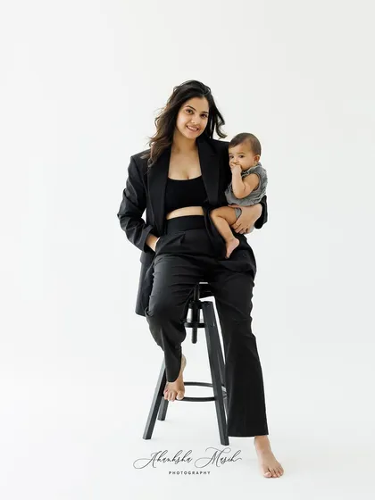 A modern and stylish portrait of a mother and her baby. This image shows that family portraits can be both chic and full of love.