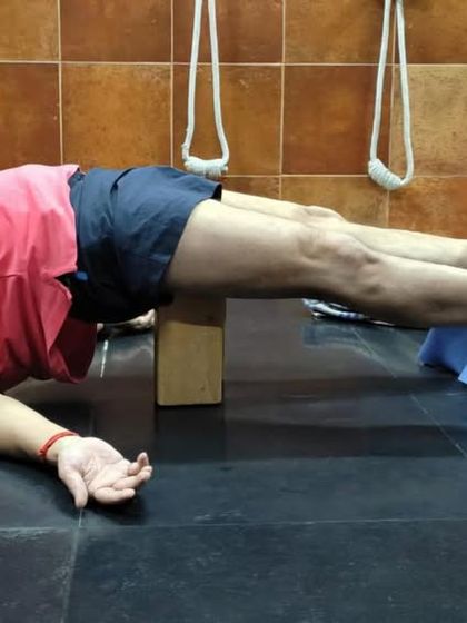 A restorative pose using a chair and block to support the legs and pelvis. This variation of Setu Bandha Sarvangasana (Bridge Pose) calms the mind and relieves fatigue.