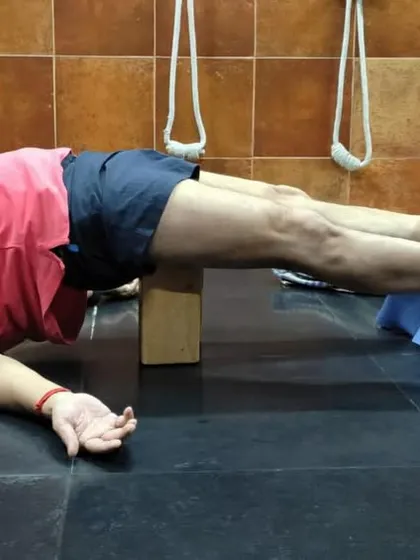A restorative pose using a chair and block to support the legs and pelvis. This variation of Setu Bandha Sarvangasana (Bridge Pose) calms the mind and relieves fatigue.