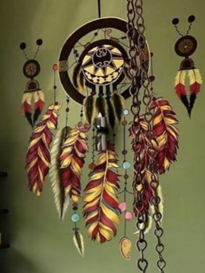 A closer look at the painted dreamcatcher. The detail in the feathers and the illusion of the hanging chains make this a truly special and eye-catching piece.