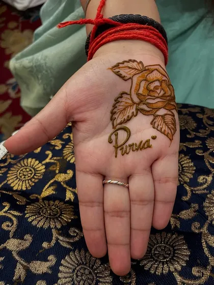 A simple and beautiful design for a guest, featuring a rose and the name 'Purva'. I can create quick and lovely designs for all your wedding guests.