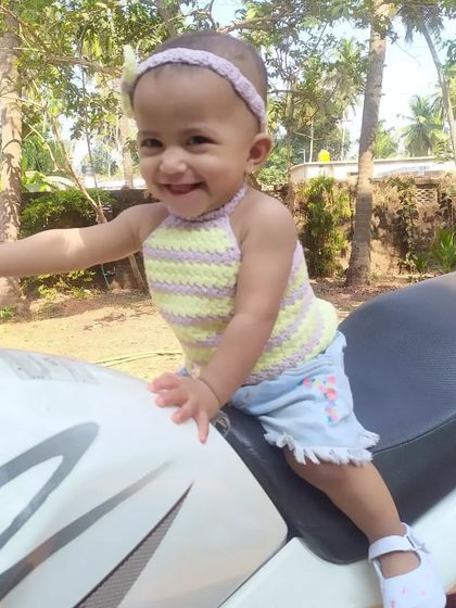 A happy smile says it all! This halter top is designed for comfort and style, allowing for plenty of movement while looking absolutely adorable.