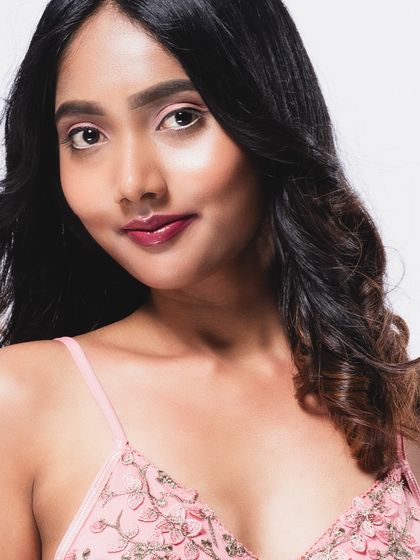 A close-up beauty shot with a direct and engaging gaze.