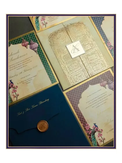 For this suite, we embraced the richness of royal jewel tones. The design features intricate patterns inspired by palace architecture, with elegant peacocks and hanging lanterns, all brought together with a custom wax seal on a deep blue pocket-fold envelope.