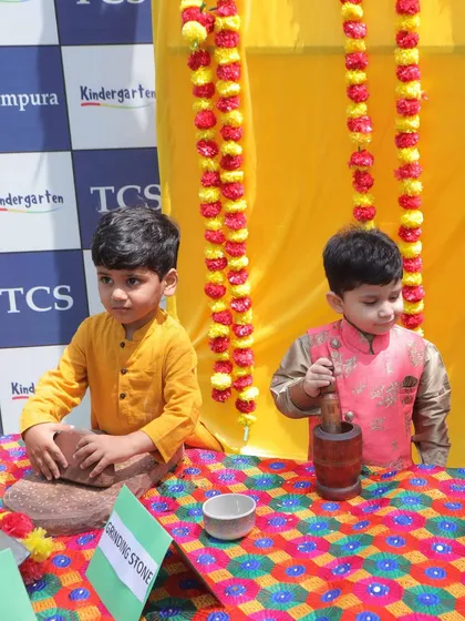 Our little stars learn about Punjabi culture during our Baisakhi celebrations. Here, two boys explore traditional tools like the grinding stone and mortar and pestle, making for a hands-on history lesson.