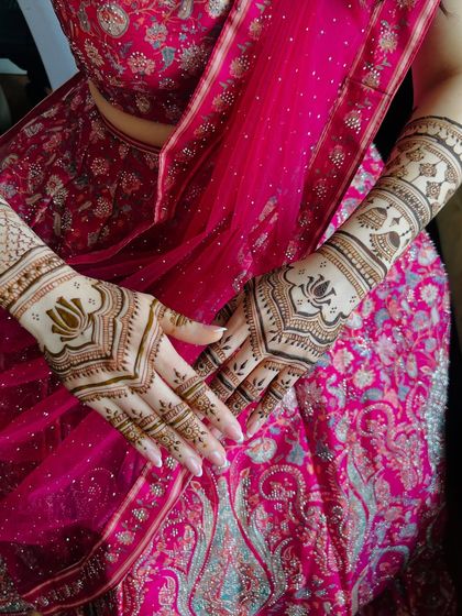 Another angle of the beautiful henna for the Japanese bride, set against her stunning pink lehenga.