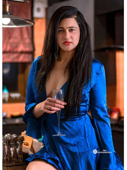 Another angle from the indoor glam shoot, showcasing the full look and the elegant atmosphere of the setting.