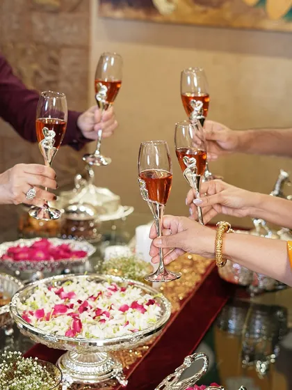 A group raises a toast with my heart-themed champagne glasses, capturing a moment of shared joy. These glasses are designed to be part of your most cherished memories.