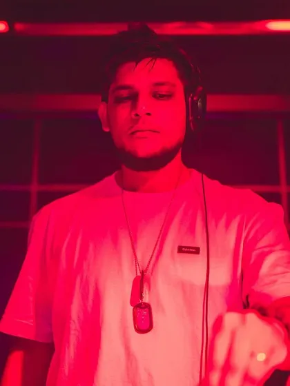 A powerful shot of me under intense red lighting, focused and in control of the music.