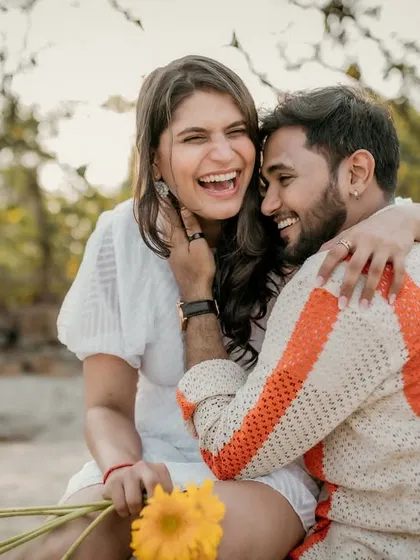 The best moments are the unscripted ones. This shot from a beach picnic pre-wedding session is all about genuine laughter and the pure joy of being together, which is the feeling I always aim to capture.