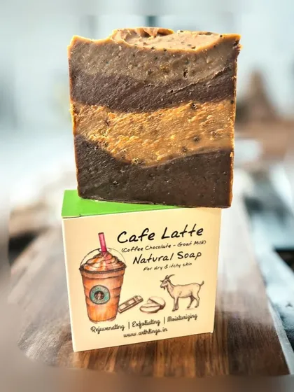 Our Café Latte Natural Soap, a treat for your skin. Made with coffee, chocolate, and goat milk, this cold-process bar rejuvenates and exfoliates, leaving your skin feeling soft and refreshed.