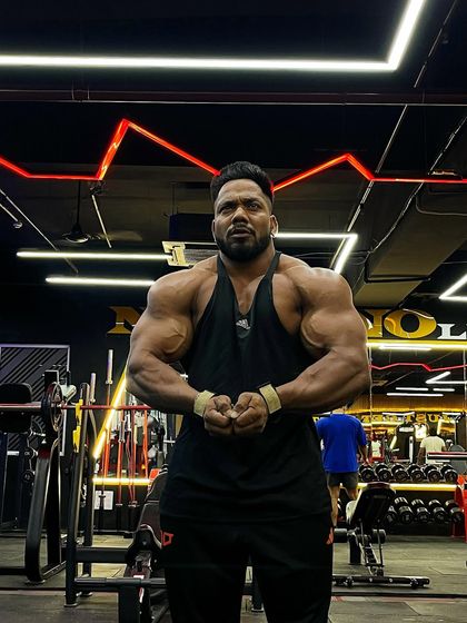 Success is built with daily habits. A most muscular pose in the gym.