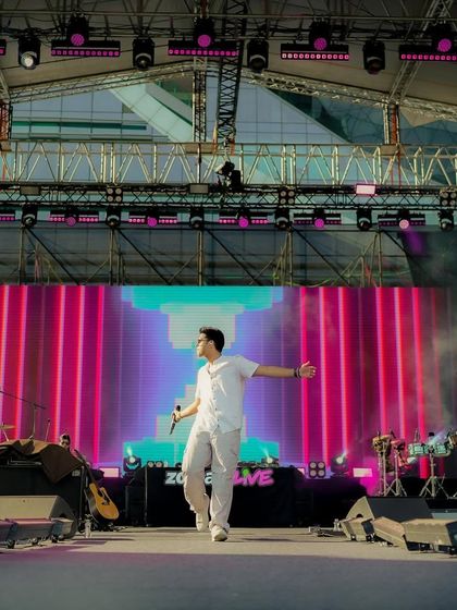 Walking the stage at Zomaland. The setup for this festival was huge, and we made sure to use every inch of it to connect with the audience. This is the kind of dynamic stage presence we bring.