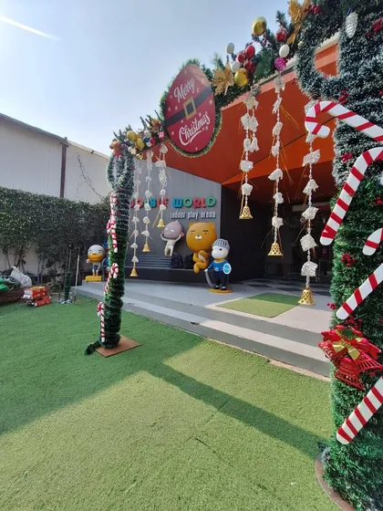 The exterior of Wobble World decorated for Christmas, with wreaths and candy canes creating a festive welcome.