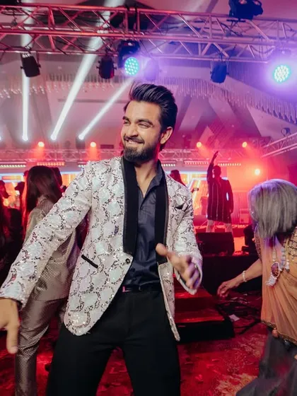 In the middle of the dance floor, surrounded by happy guests. This is where I thrive, feeding off the crowd's energy and giving it right back.