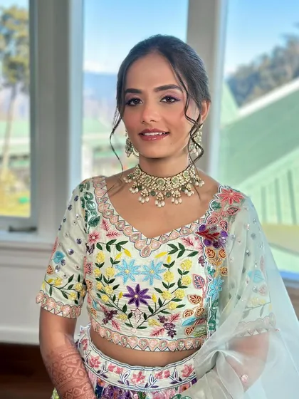 A happy portrait of the bride. Her makeup is fresh and glowing, perfect for a daytime event filled with family and friends.